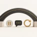 A flexible charcoal arch with stable supports, a pause symbol, speech bubble and reset arrow.