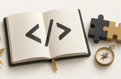 An open code notebook beside learning blocks and a gold compass.